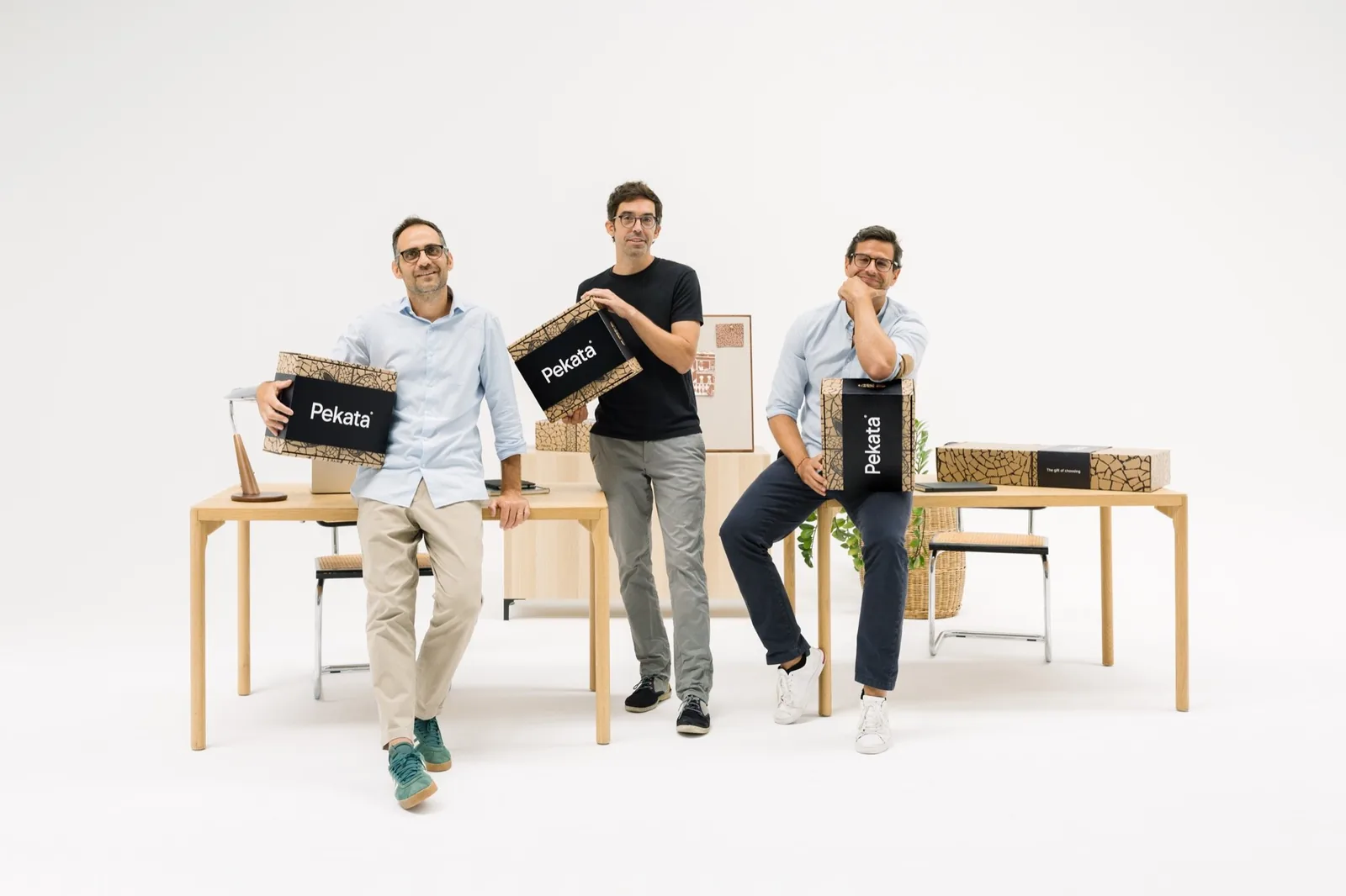 Pekata's three partners holding the brand's gift boxes